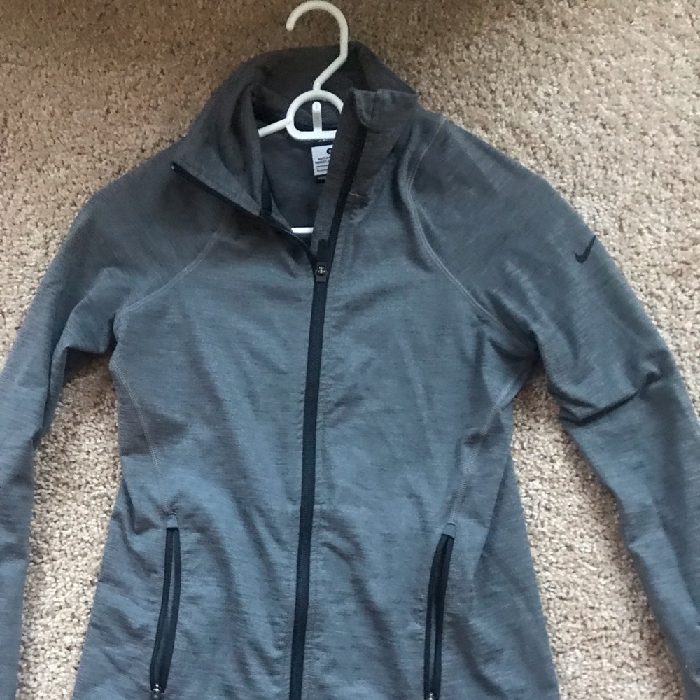 Nike dry fit zip up jacket. New without tags.